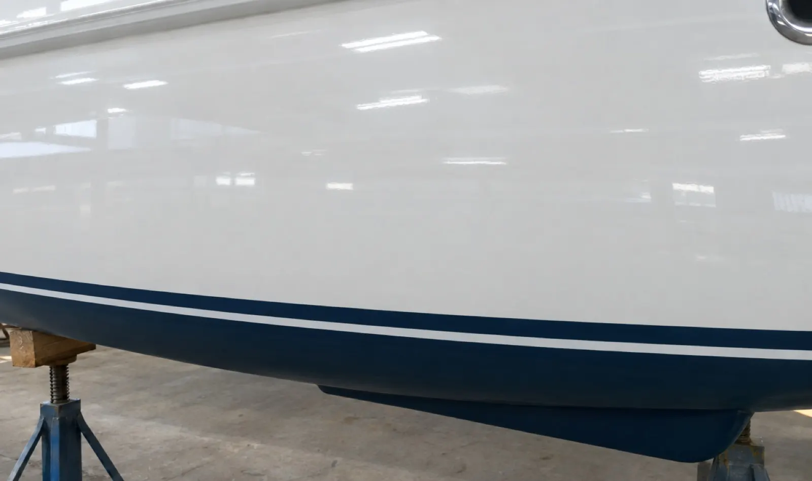 The same hull side faired and finished in color-matched gelcoat
